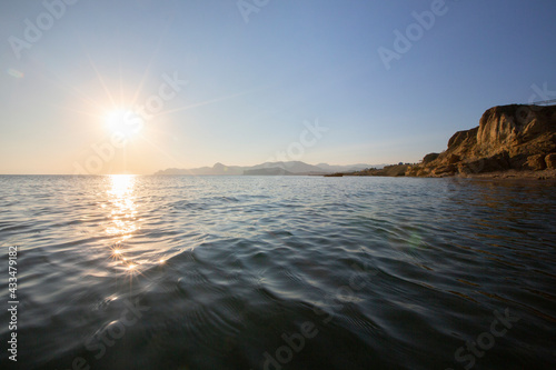 Sun glare on sea waves