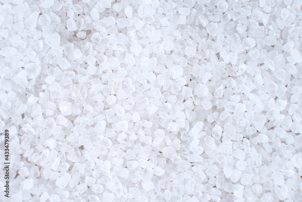 Sea salt close-up on a white background.