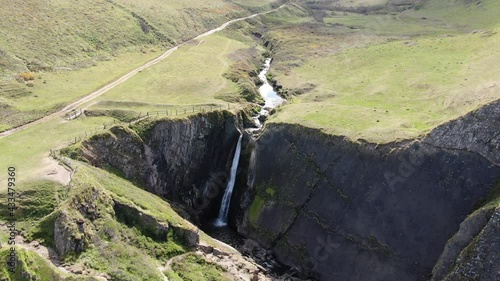 Aerial shot of Spekes Mill Mouth Waterfall, in Devon on the UK coast photo