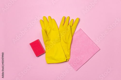 Cleaning products on a colored background. Indoor cleaning tools. Cleaning tools on pink background