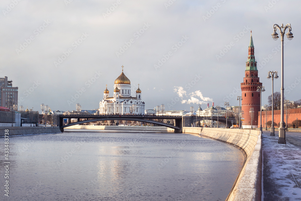 Moskva River embankment in an early frosty morning. View of the Cathedral of Christ the Savior.