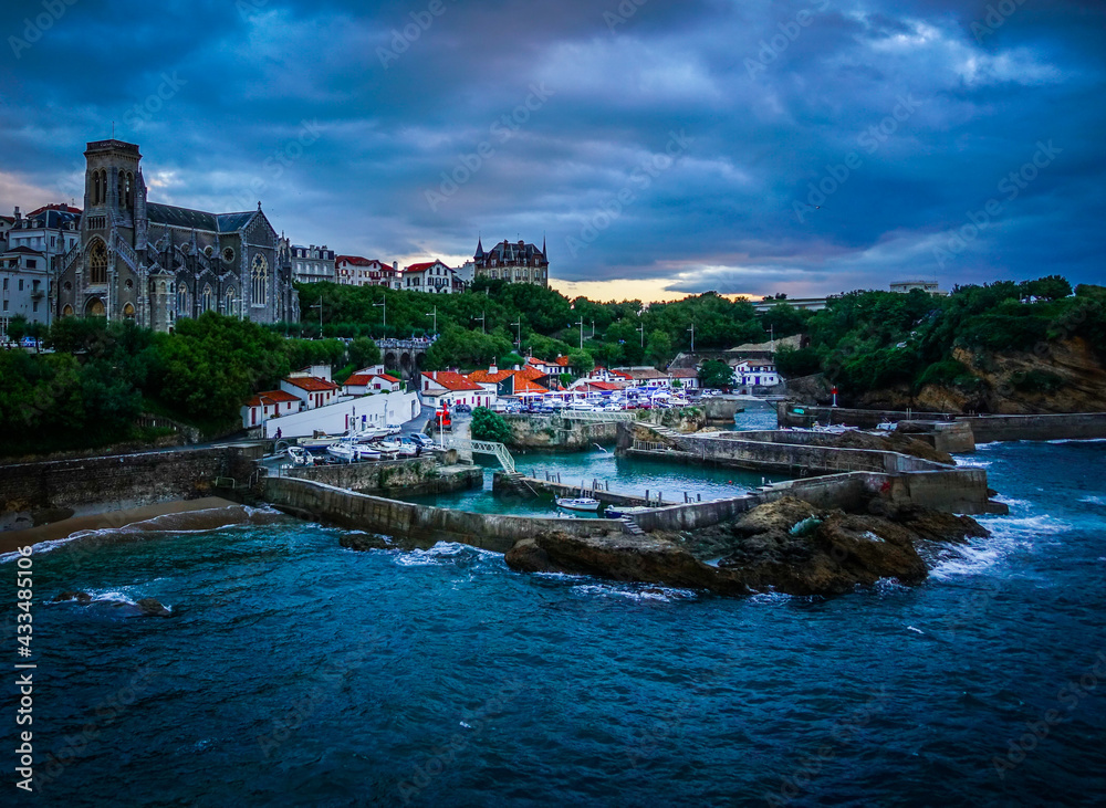 Fototapeta premium Fishing harbour at Biarritz, France, on a stormy night