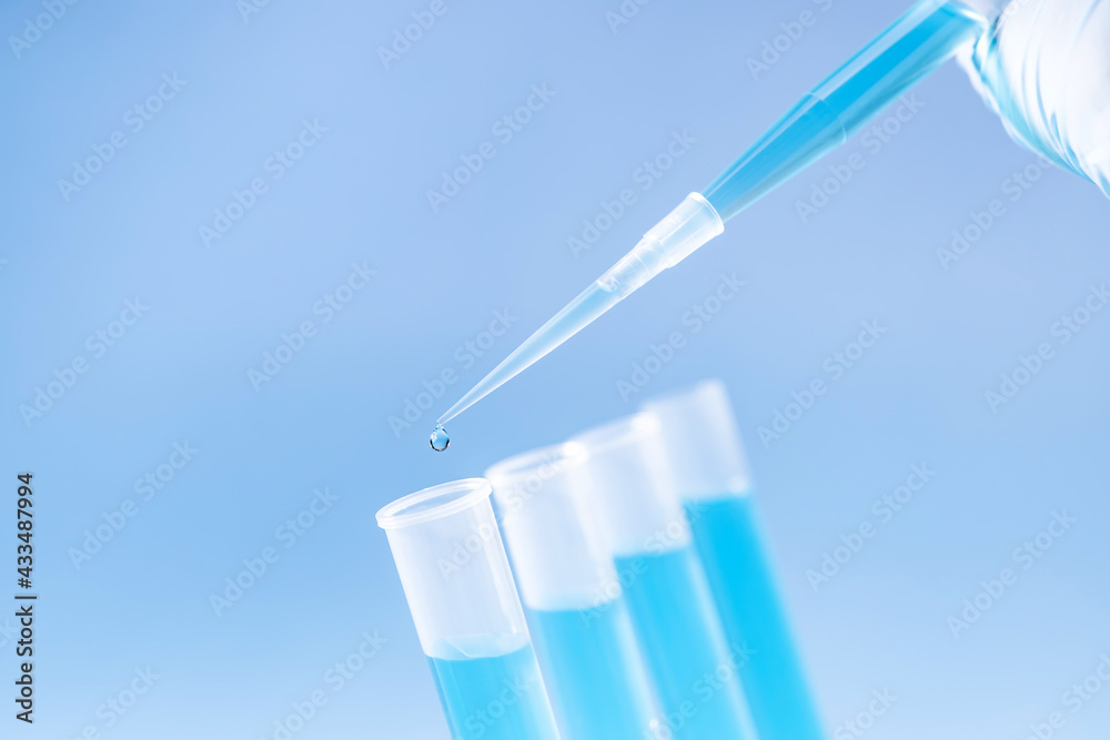 laboratory tubes with blue liquid, pipette, laboratory equipment laboratory tubes with blue liquid, pipette, laboratory equipment