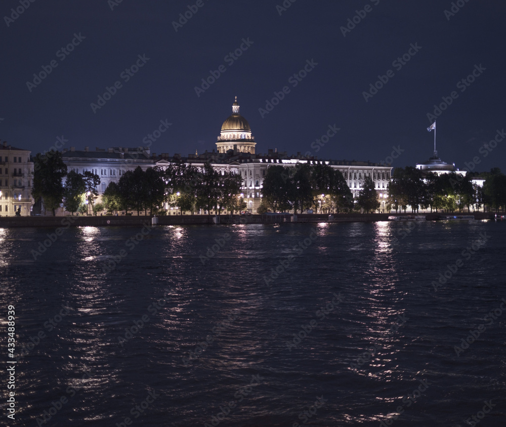 Saint-Petersburg, Russia, 31 August 2020: View across the Neva River to the Admiralteyskaya Embankment. In the background is St. Isaac's Cathedral. Photo taken from the Palace Bridge.