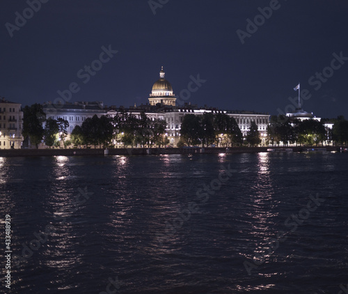 Saint-Petersburg, Russia, 31 August 2020: View across the Neva River to the Admiralteyskaya Embankment. In the background is St. Isaac's Cathedral. Photo taken from the Palace Bridge. photo