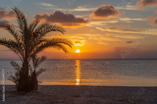 Watching the sunset from the beach in La Manga del Mar Menor, Murcia, Spain