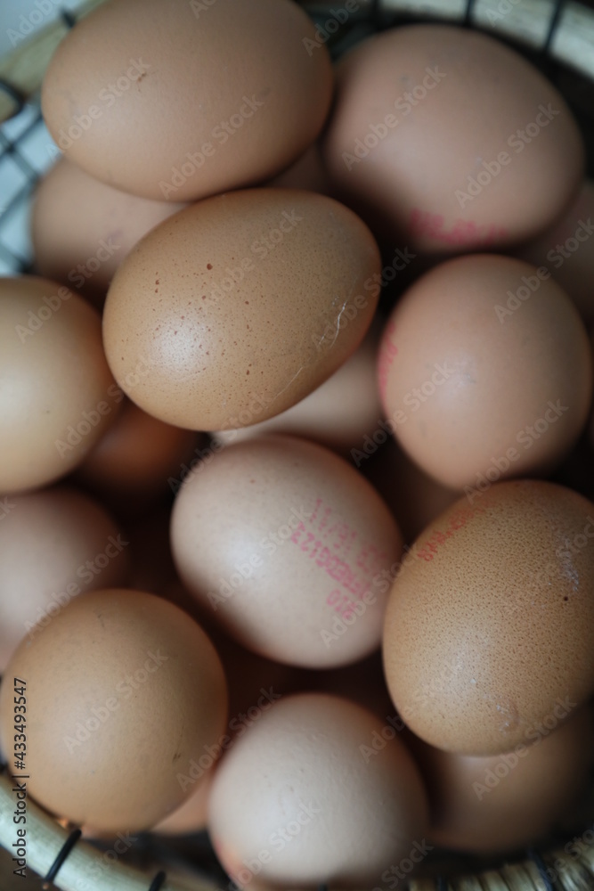 closeup of multiple eggs in a basket closeup of multiple eggs in a basket