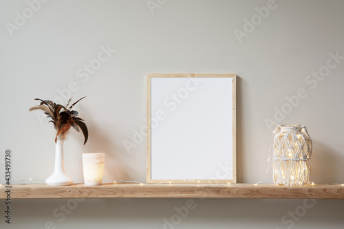 8x10 small, thin wood, vertical frame mockup for art and quotes. Bohemian style props on a light wooden shelf.