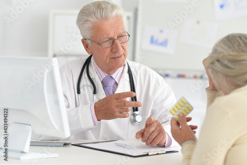 Senior doctor with a elderly patient