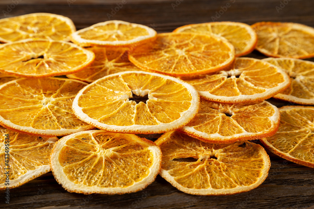 Dried orange slices on a wooden background. Dried orange slices on a wooden background.