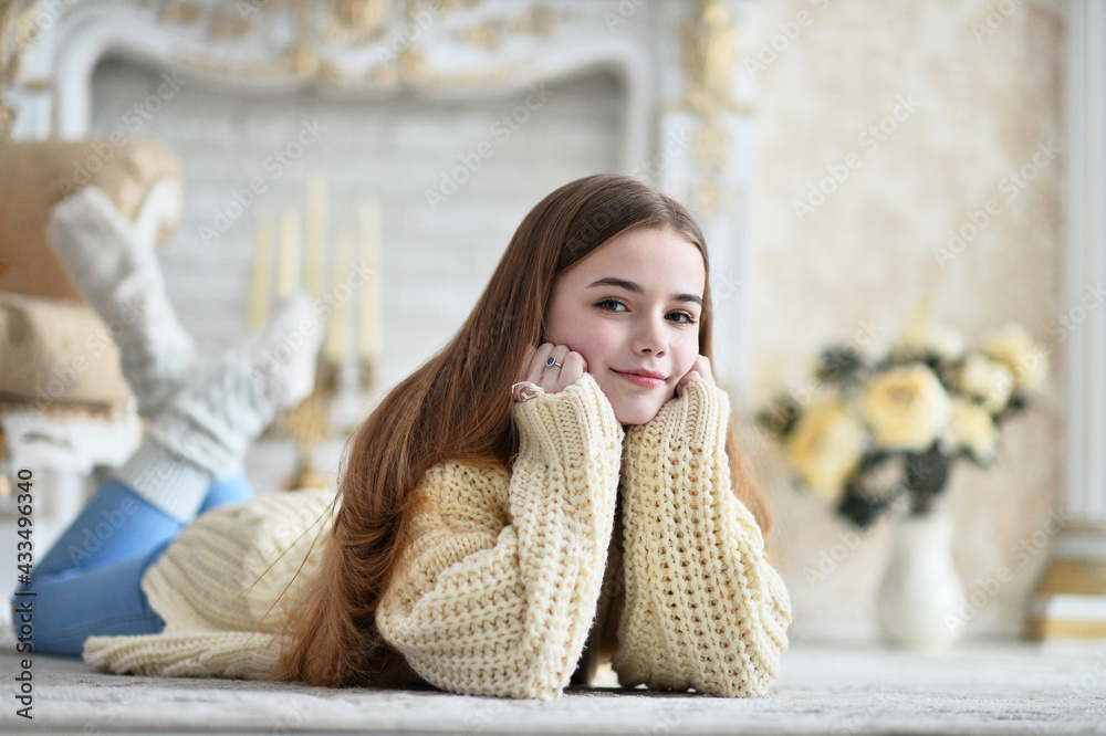 Portrait of beautiful teen girl lying on floor in room Portrait of beautiful teen girl lying on floor in room