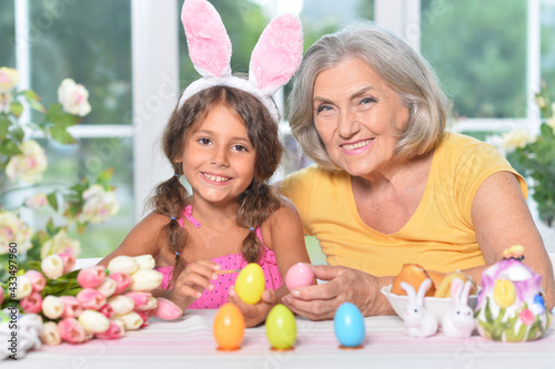 Senior grandmother and granddaughter with  Easter eggs