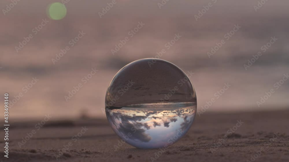 sunset sunrise view inside crystal ball..The natural view of the sea and sky are unconventional and beautiful. .A image for a unique and creative travel idea. sunset sunrise view inside crystal ball..The natural view of the sea and sky are unconventional and beautiful. .A image for a unique and creative travel idea.