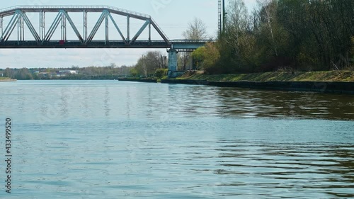 Approaching to bridge. View from sailing boat. Spring nature in Russia photo