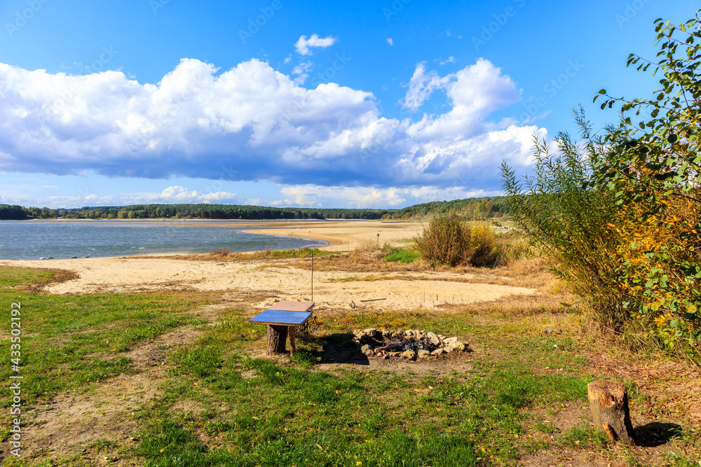 Fireplace on beautiful sandy beach at Chancza lake in Swietokrzyskie region in central Poland Fireplace on beautiful sandy beach at Chancza lake in Swietokrzyskie region in central Poland