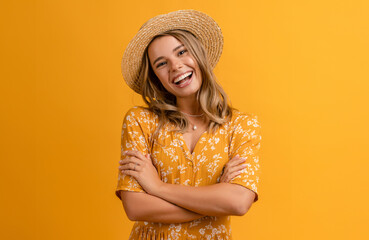 beautiful attractive stylish woman in yellow dress and straw hat