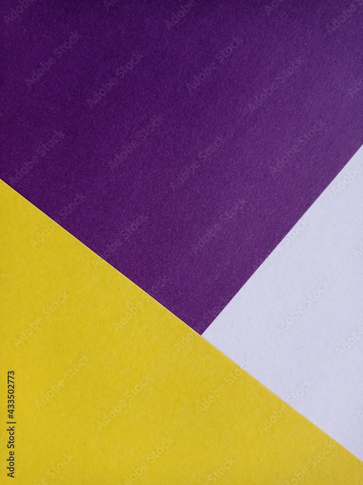 The background consists of purple, yellow and white triangles. Wallpaper The background consists of purple, yellow and white triangles. Wallpaper