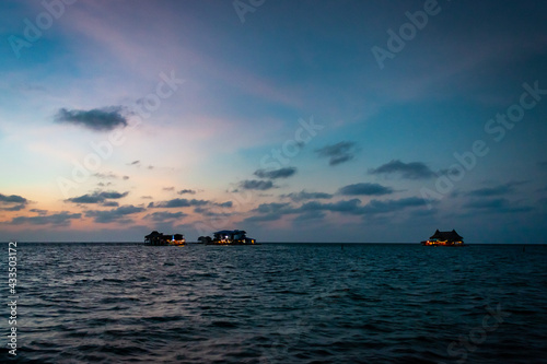 Floating house in the beach during a sunset, Caribbean sunset 