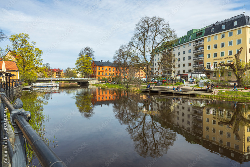Fototapeta premium Beautiful city landscape view of colorful buildings along river side. Uppsala. Sweden. Europe. 