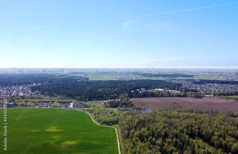 Aerial view of the summer landscape with green fields and meadows