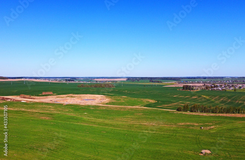 Aerial view of the summer landscape with green fields and meadows