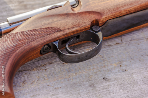 Riffle barrel, gun barrel close up on rustic wooden surface