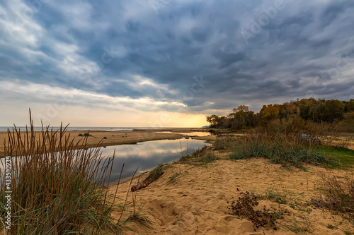 Small lake near sea sand with sky reflection © EdVal