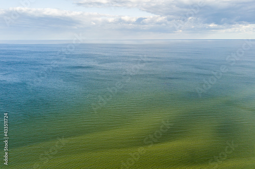 Aerial view of green Baltic sea in sunny spring day, Latvia.