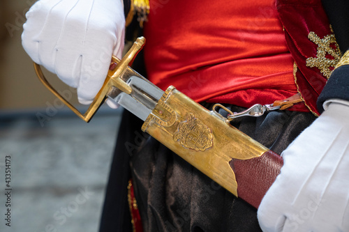 Pull the saber out of its scabbard
