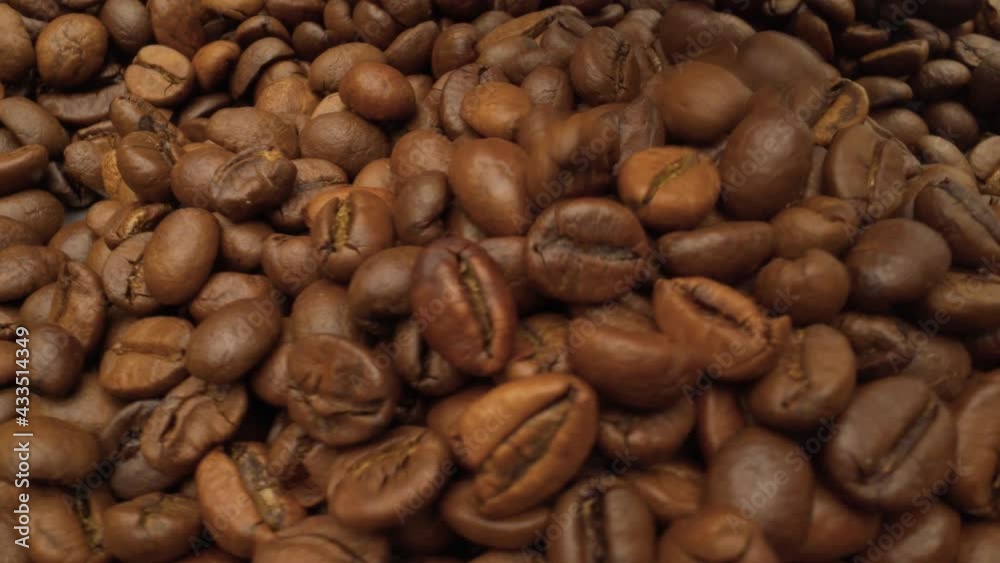 Men hand takes the coffee beans for quality control. The hand takes the coffee beans. Men hand takes the coffee beans for quality control. The hand takes the coffee beans.