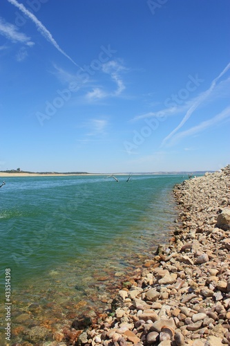 inland lake with crystal clear water blue sky