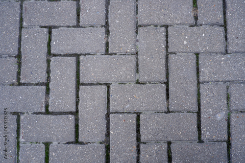 Gray cobbled pavement close up top view