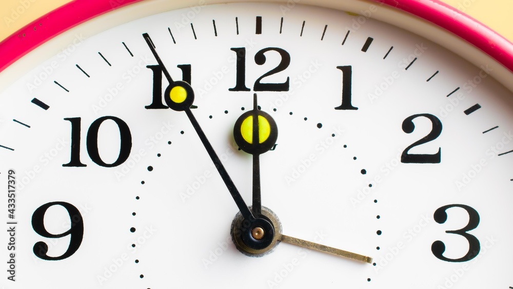 Mechanical hand clock white dial. Spring alarm clock. Mechanical hand clock white dial. Spring alarm clock.