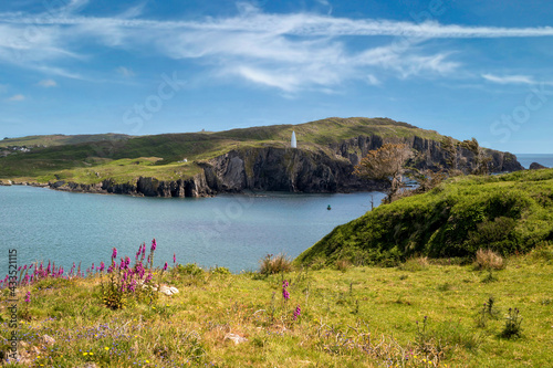 Famous Baltimore Beacon seen across narrow strait from Sherkin Island in County Cork, Ireland.