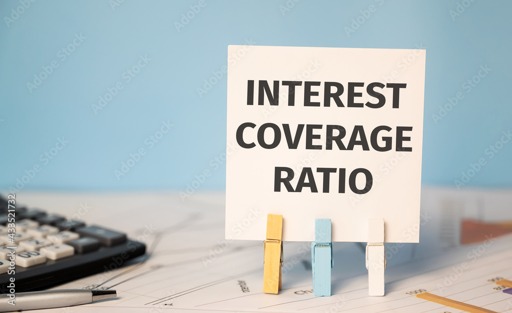 Fototapeta premium INTEREST COVERAGE RATIO text near financial reports and calculator.Financial concept.