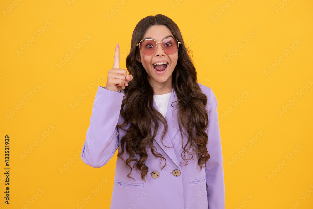 kid in jacket and sunglasses inspired with great idea on yellow background, inspiration. kid in jacket and sunglasses inspired with great idea on yellow background, inspiration.