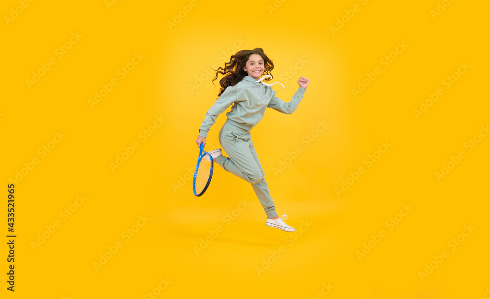 energetic child with tennis racquet. teen girl run to training. dedicated to fitness energetic child with tennis racquet. teen girl run to training. dedicated to fitness