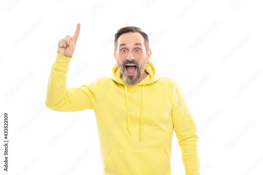 mature surprised man pointing finger up. smiling senior guy presenting product isolated on white