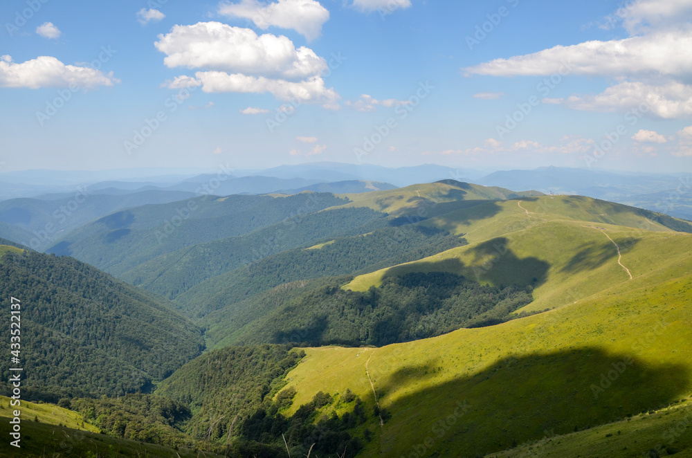 Beautiful alpine landscape of mountain ridge Borzhava with rolling grassy hills during a sunny summer day