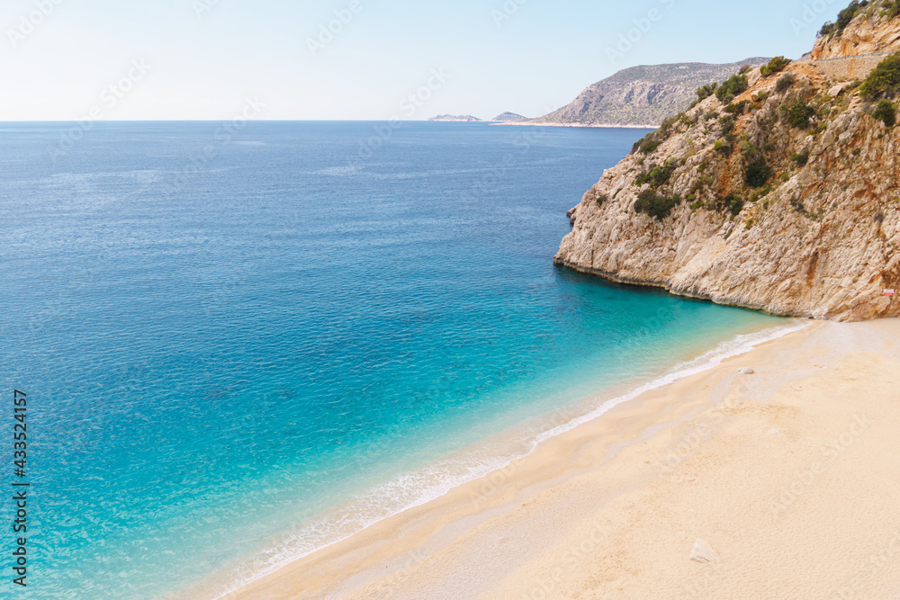 Kaputas beach. People enjoying sun and sea at the beautiful turquoise sea and sandy beach in Turkey
