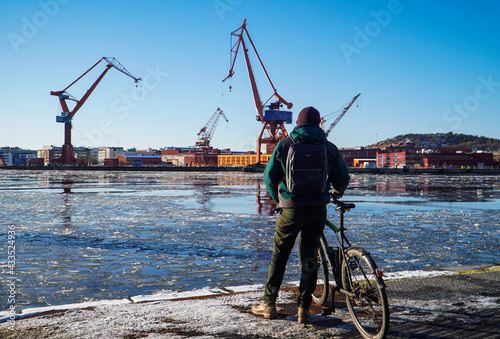 Man with a bicycle in the winter water Gothenburg