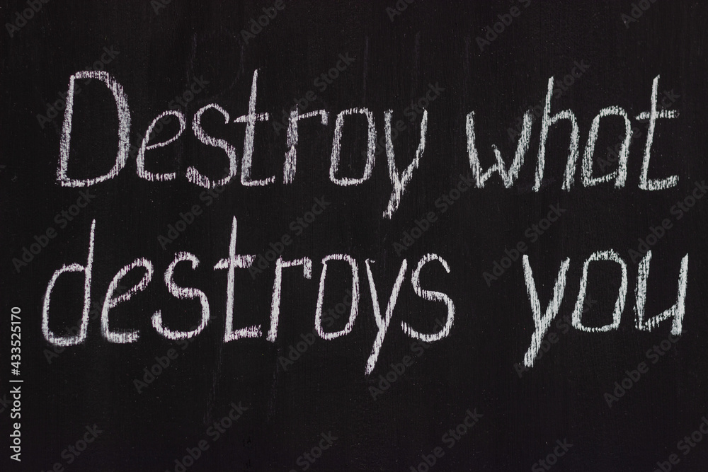 Chalkboard text Destroy what destroys you. Motivational lettering
