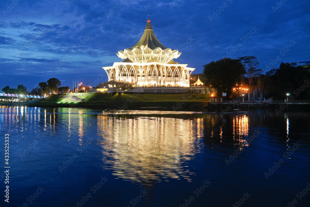 State Legislative Complex (lighted at night) on Sungai Sarawak (Sarawak River), Kuching, Sarawak (Borneo), Malaysia