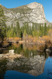 view of mirror lake and north dome on a winter day at yosemite national park in california