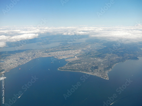 Aerial View of Seattle, Washington, Area from an Airliner showing a Peninsula with a Layer of Clouds on the Horizon