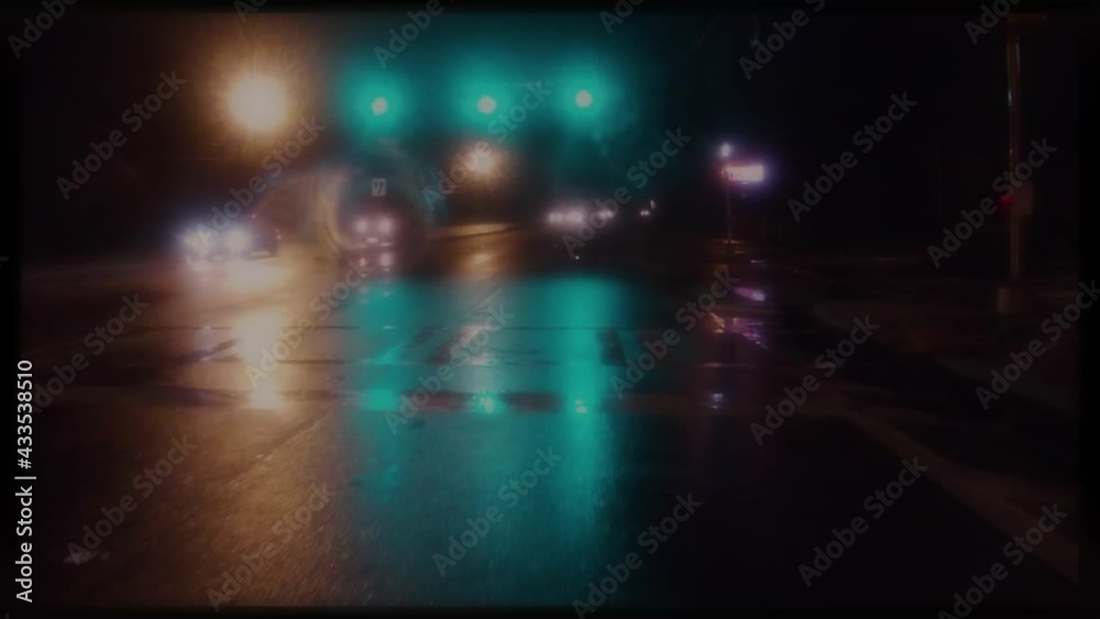 POV FPV driving at night in the rain with red and green light blurry dreamy POV FPV driving at night in the rain with red and green light blurry dreamy