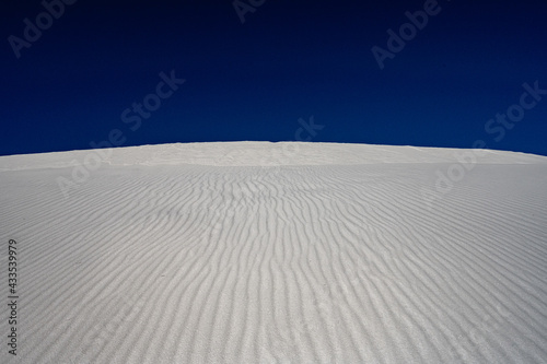 Bright White Sand Dunes with Deep Blue Sky © kellyvandellen