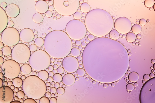 Colorful artistic of oil drop floating on the water. Abstract pastel bubble background.