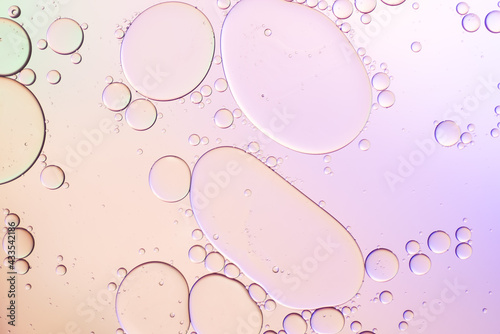 Colorful artistic of oil drop floating on the water. Abstract pastel bubble background.