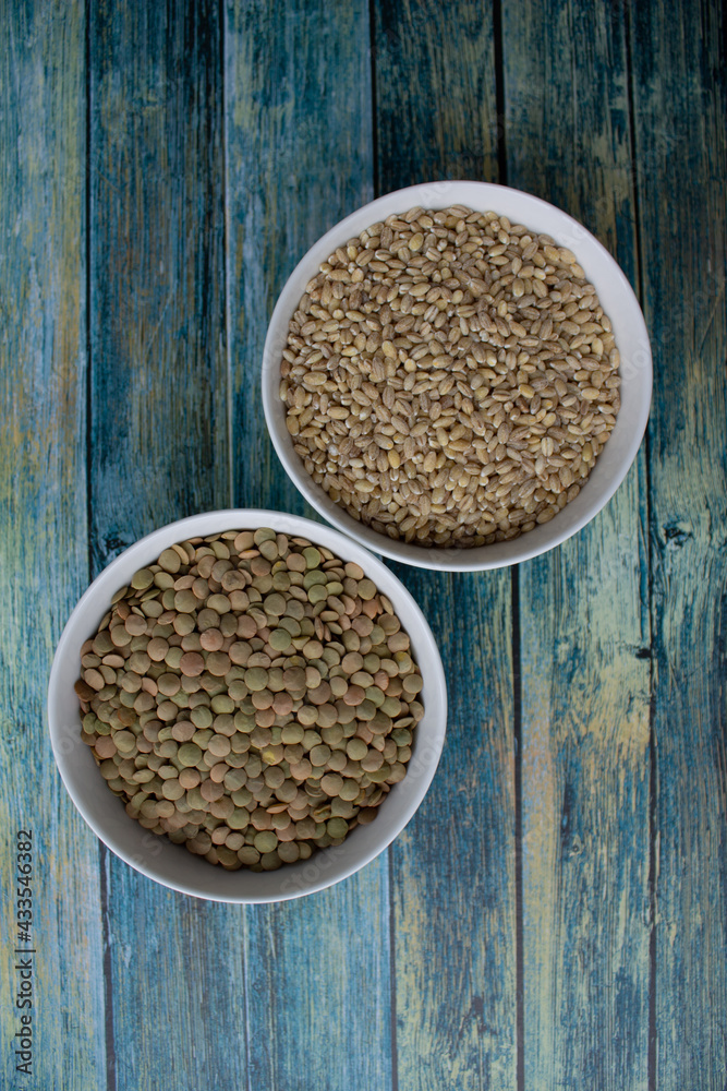 cereals in white plates, on a turquoise table, food cereals in white plates, on a turquoise table, food